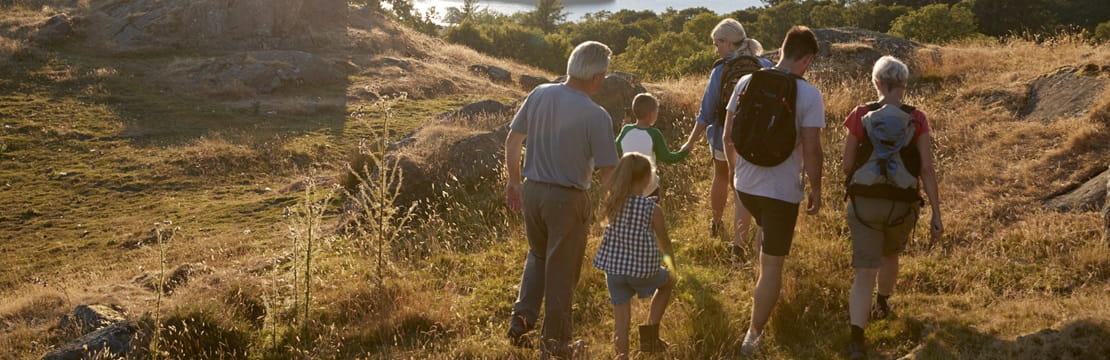 Multigenerational family on a hike.